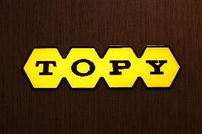 Topy Industries signage and logo